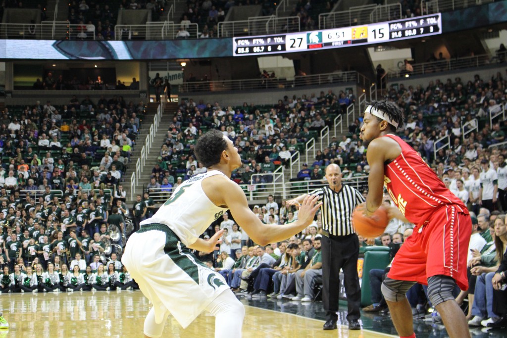 Ferris State sophomore guard Noah King looks to enter the ball into the post past Michigan State's Bryn Forbes in an exhibition game against the Spartans on Nov. 9. The Bulldogs fell 93-57 in the Breslin Center in East Lansing, Mich.